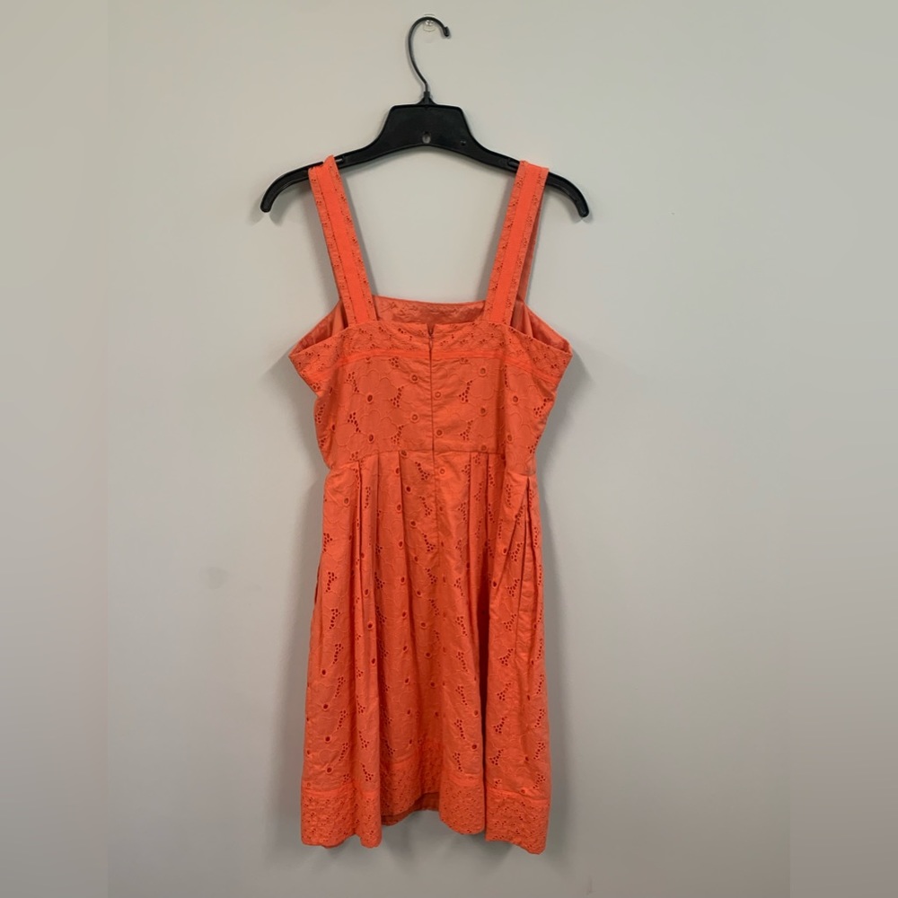 Coral, eyelet sundress. Size 4. Hits right below knee.